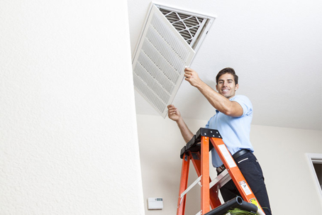 hvac tech cleans filter