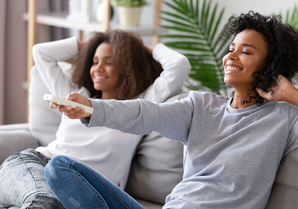 woman change temp with remote