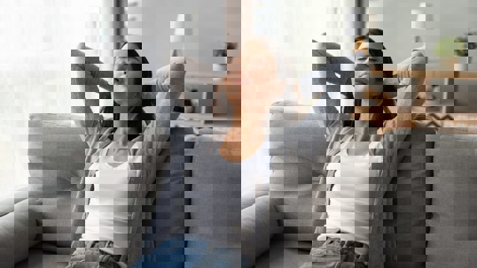 woman relaxing on couch