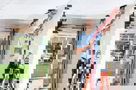 person cleaning ducts