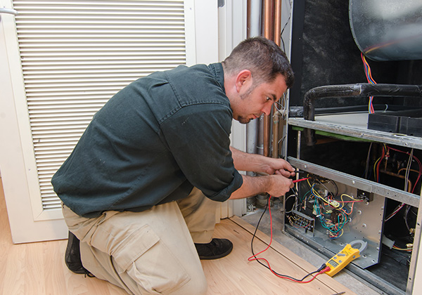 Technician Testing Hvac Components